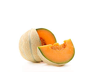 Charentais melon med orange frugtkød og lys rillet skal